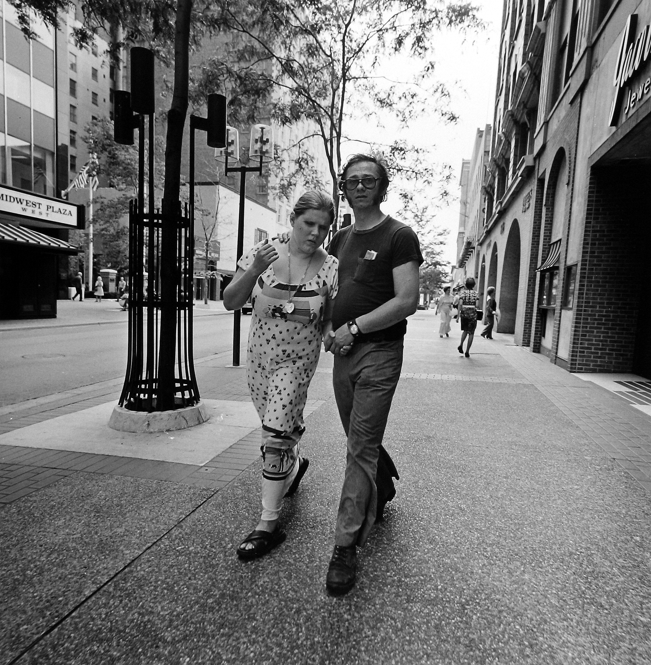 Tom Arndt - Couple walking on the Nicolett Mall, 1975  - Howard Greenberg Gallery