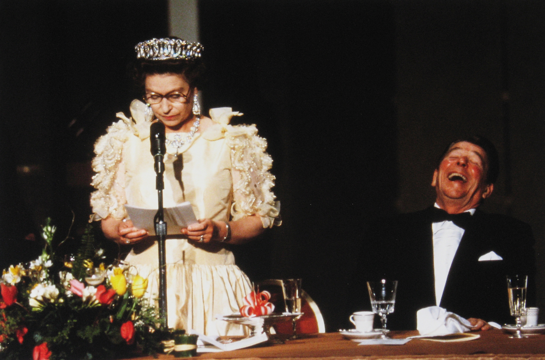 Diana Walker - President Reagan laughing at humorous remarks made by H.M. Queen Elizabeth II, M.H. de Young Memorial Museum, San Francisco, March 3, 1983 - Howard Greenberg Gallery - 2018