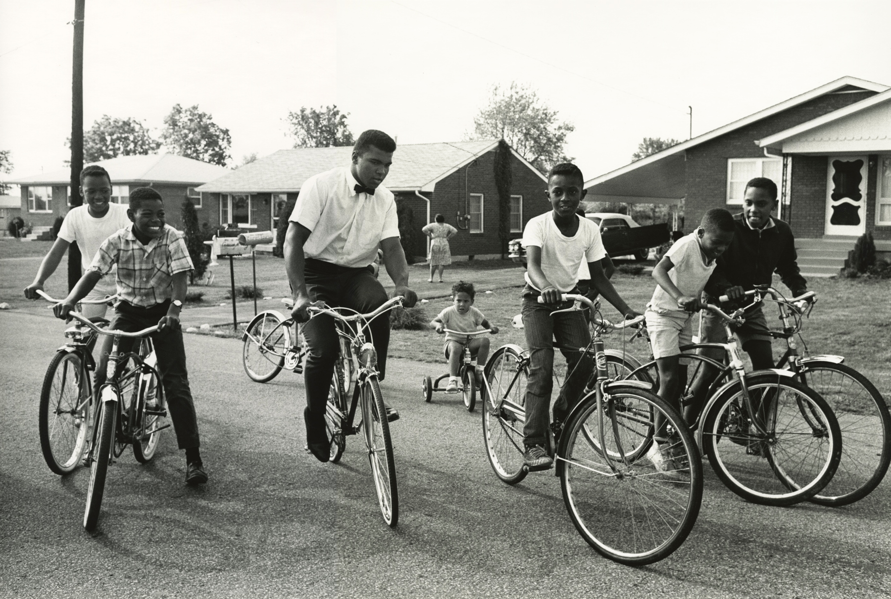 Muhammad Ali and Boys with Bikes, Louisville, Kentucky, 1963  Gelatin silver print; printed later   16 x 20 inches
