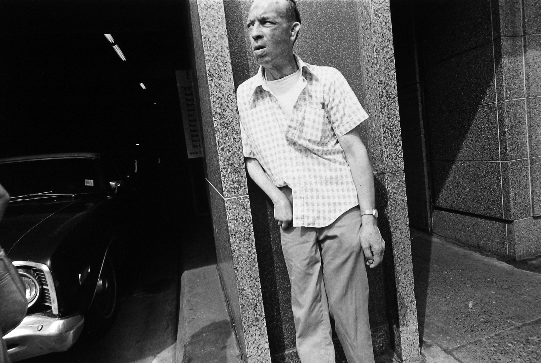 Tom Arndt - Leaning man, Minneapolis, MN, 1975   - Howard Greenberg Gallery