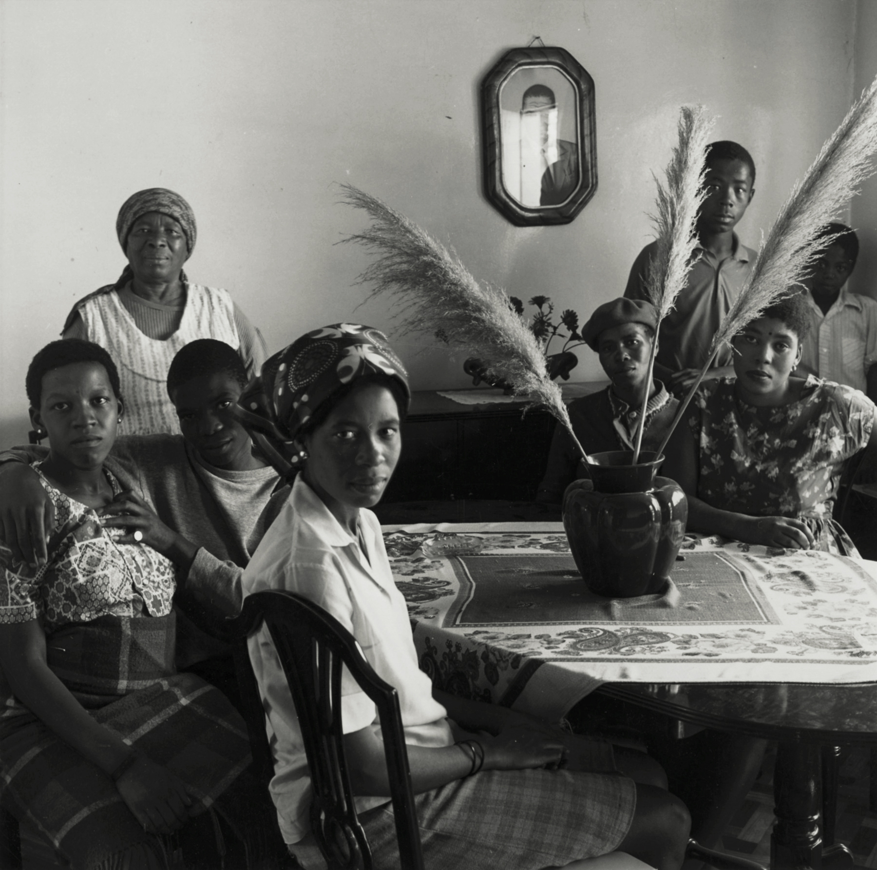 David Goldblatt - Untitled (group gathered around table), 1972 - Howard Greenberg Gallery