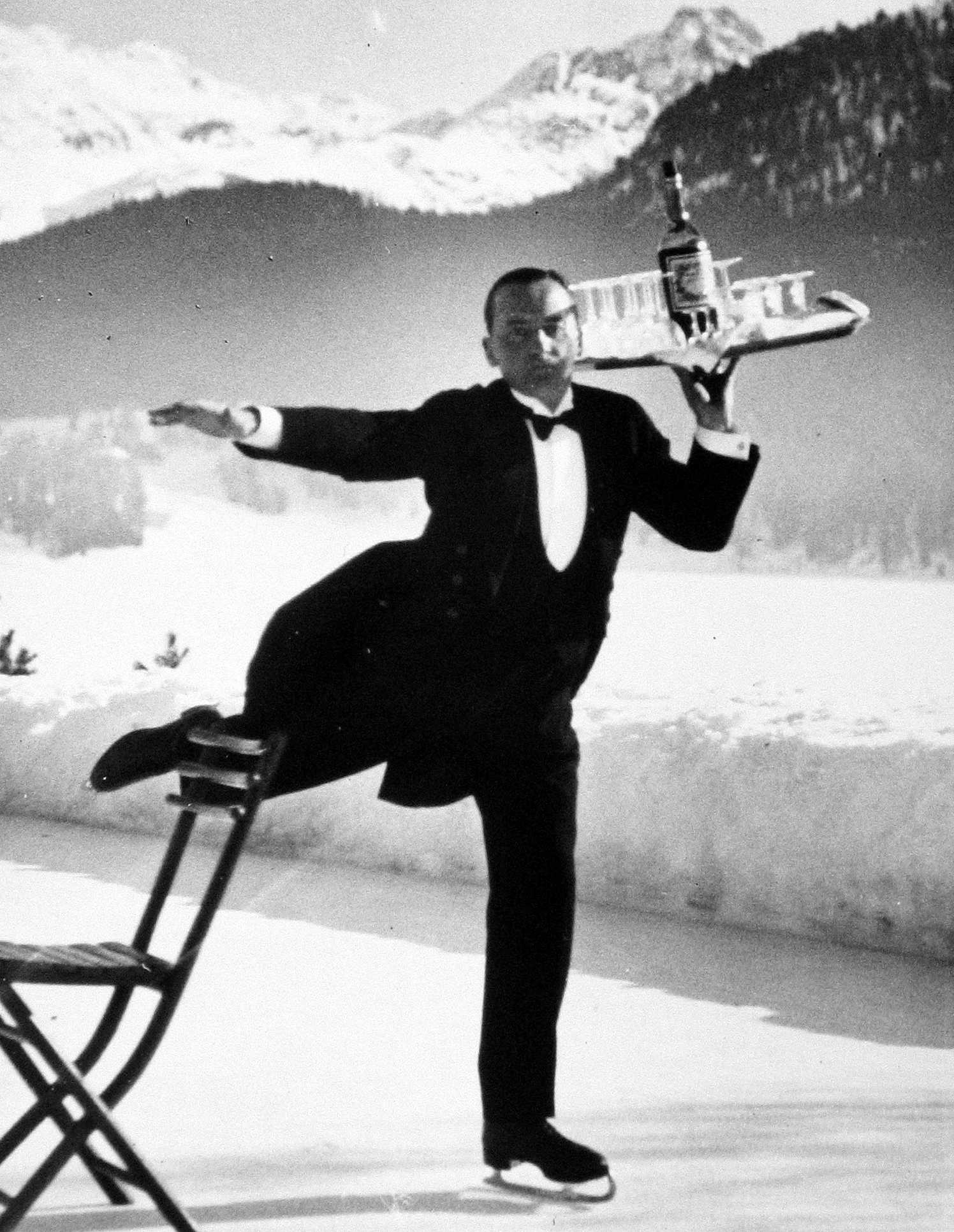 Alfred Eisenstaedt - Waiter on iceskates at the ice rink of the Grand Hotel, St. Moritz, 1932 - Howard Greenberg Gallery