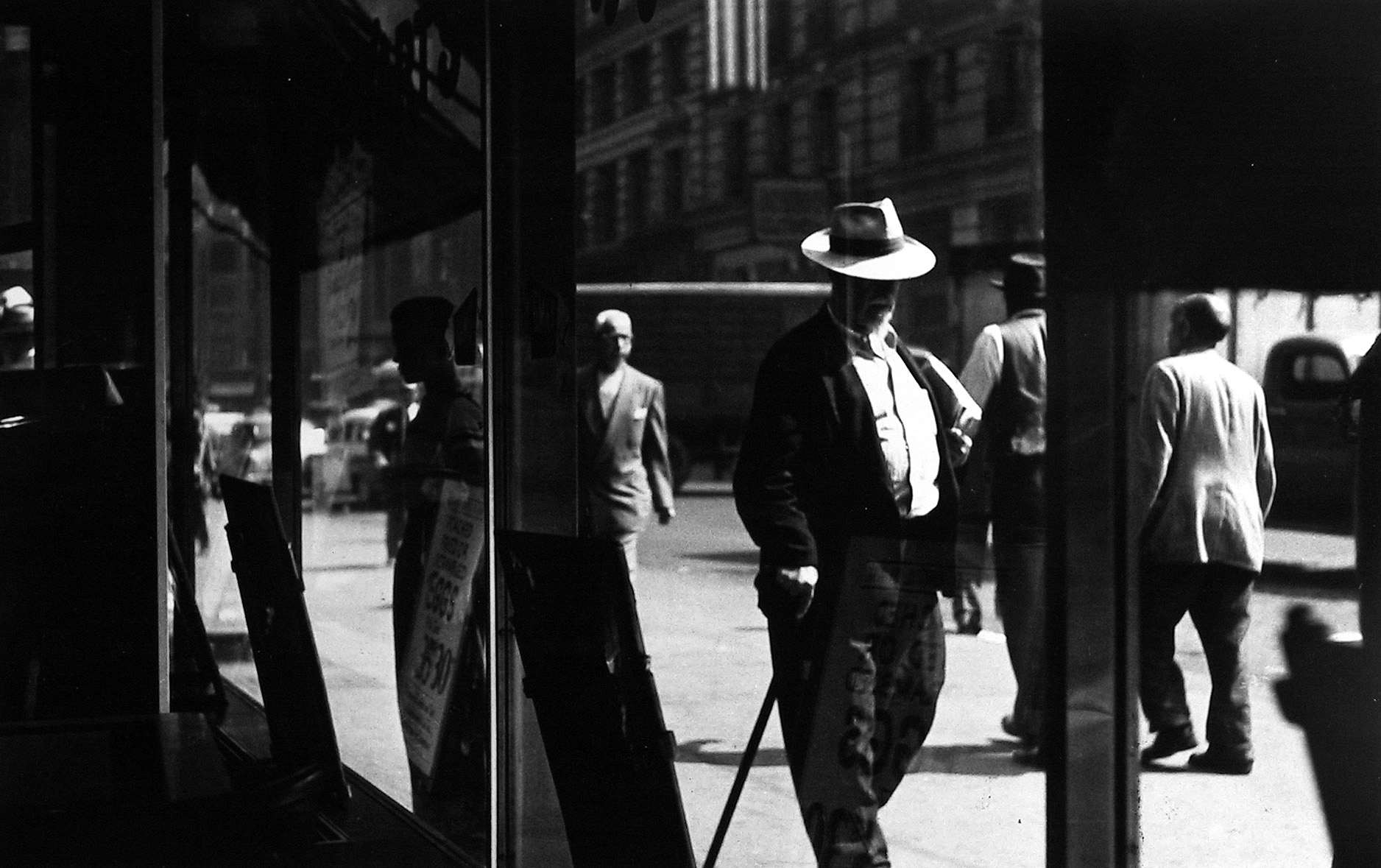 Sy Kattelson - Man with Cane, 1950 - Howard Greenberg Gallery