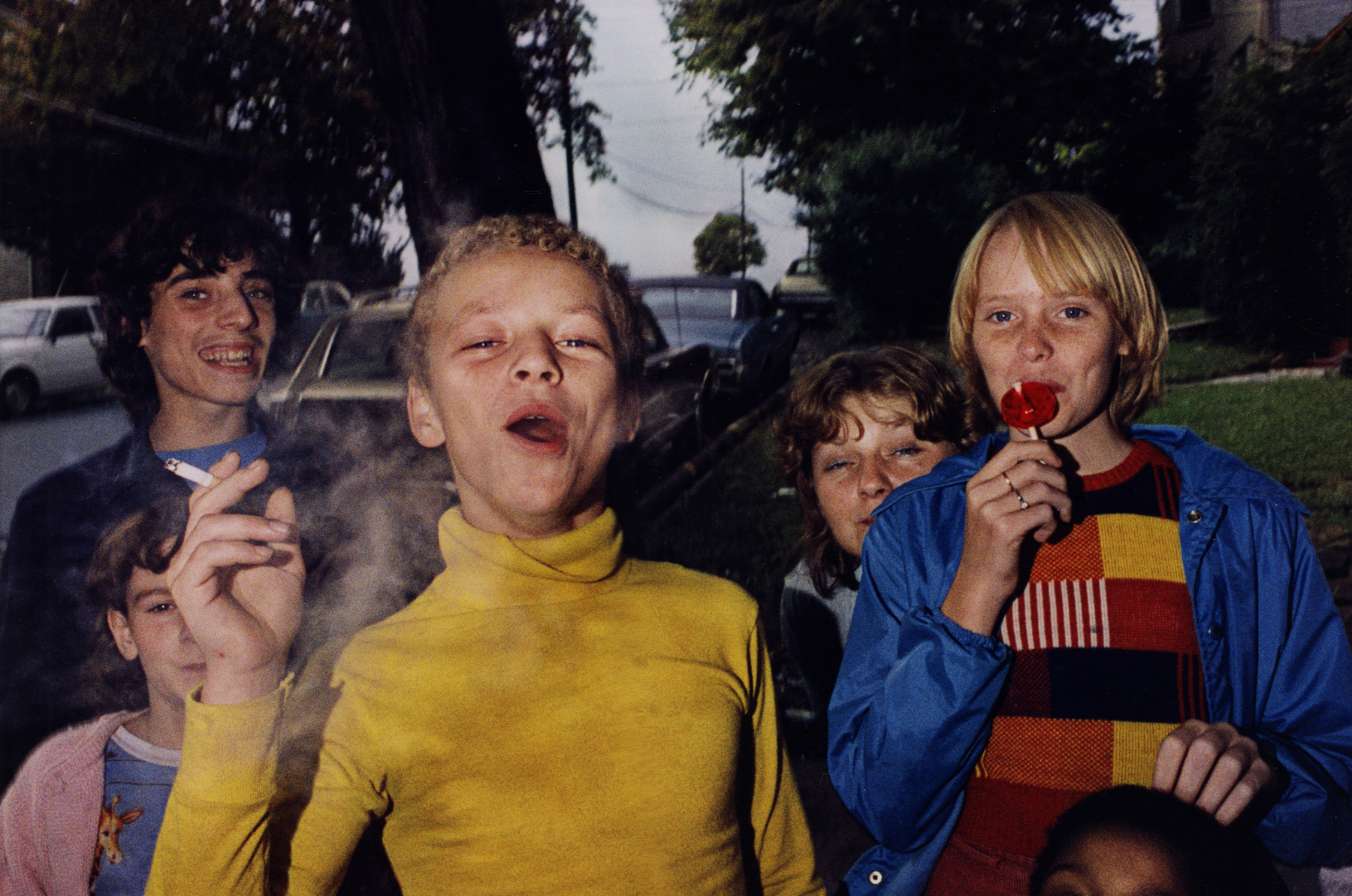 Mark Cohen, Boy in Yellow Shirt Smoking, Scranton, PA, 1977     Dye transfer print, printed 2009 11 7/8 x 18 inches