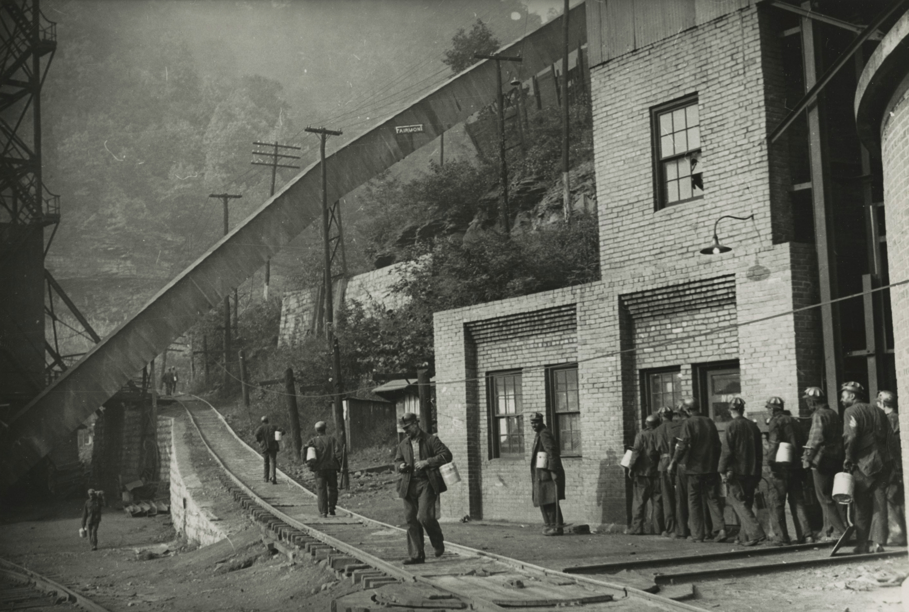 Marion Post-Wolcott - Untitled (men on tracks), 1941 - Howard Greenberg Gallery