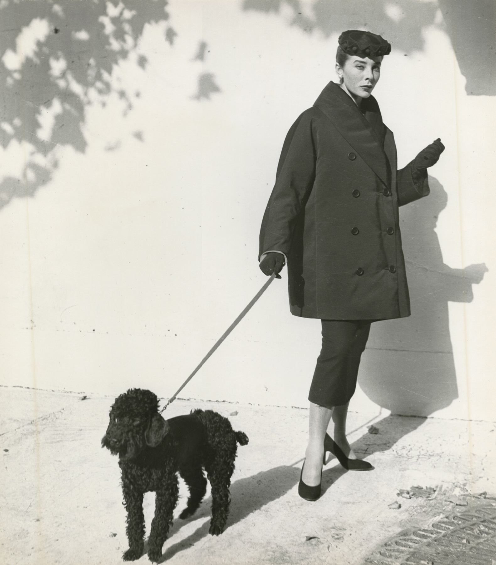 Bettina Graziami in the Vaugirard Courtyard, Paris, for Vogue Magazine, 1951 Gelatin silver print; printed c.1951 15 1/8 x 13 3/8 inches