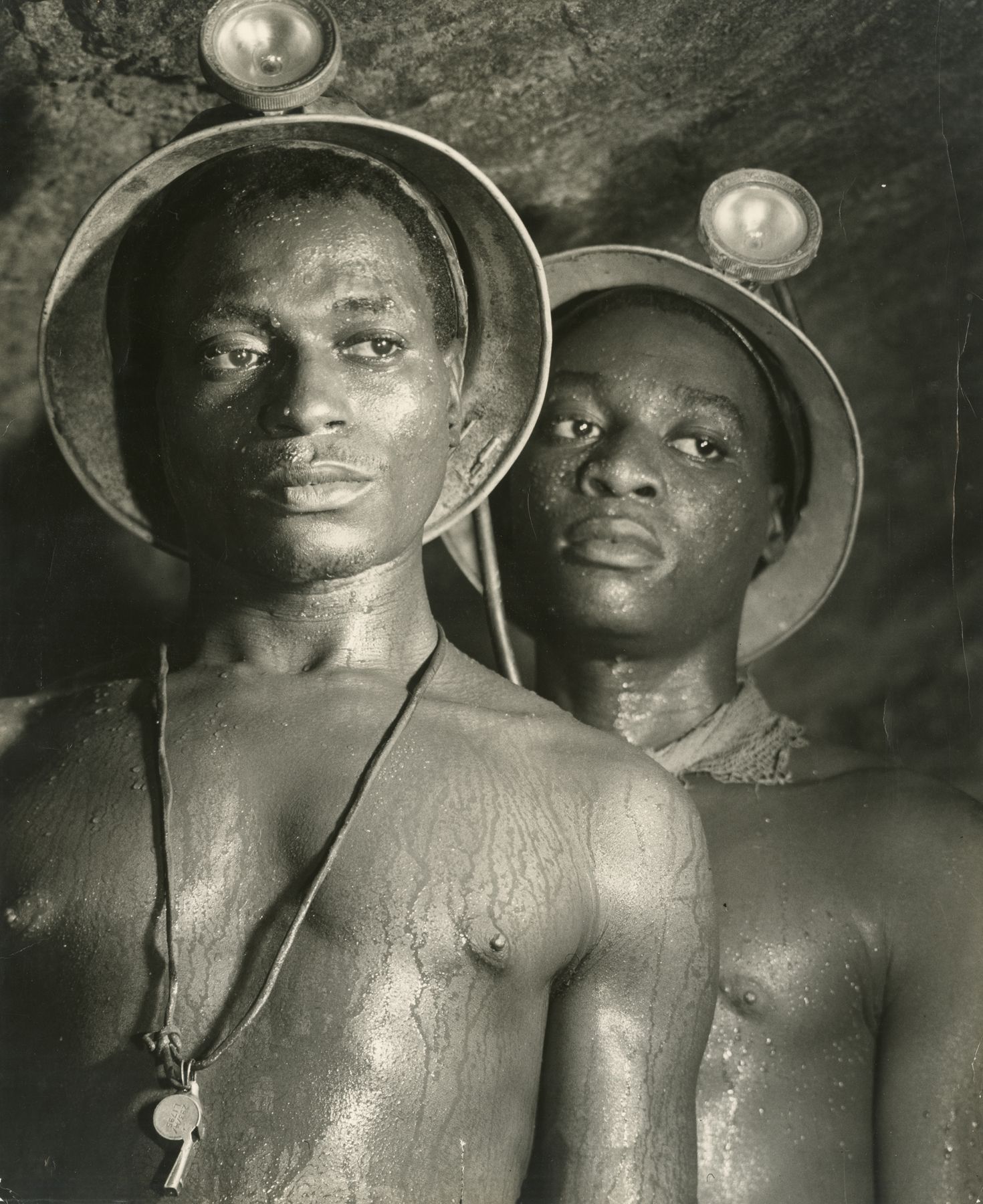 Gold Miners Nos. 1139 and 5122, Johannesburg, South Africa, 1950Gelatin silver print; printed c.196418 3/4 x 15 1/4 inches