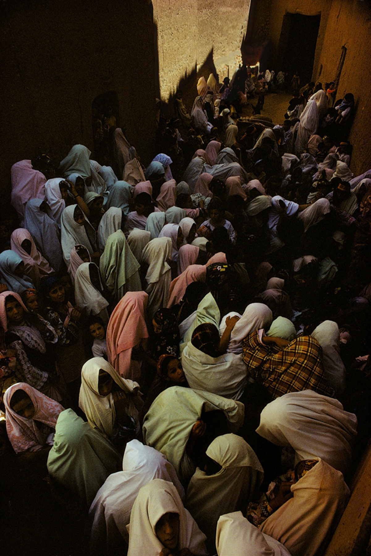 Women praying on the shrine of a marabout, Tineghir, Morocco, 1986  Archival pigment print; printed later  23 x 16 inches