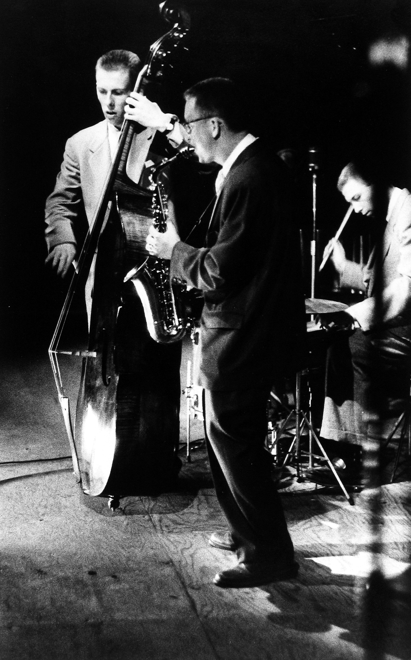 Sy Kattelson - Red Mitchell on bass, Lee Kanity on sax, and Jeff Martin on drums at 1st Newport Jazz Festival, 1954 - Howard Greenberg Gallery