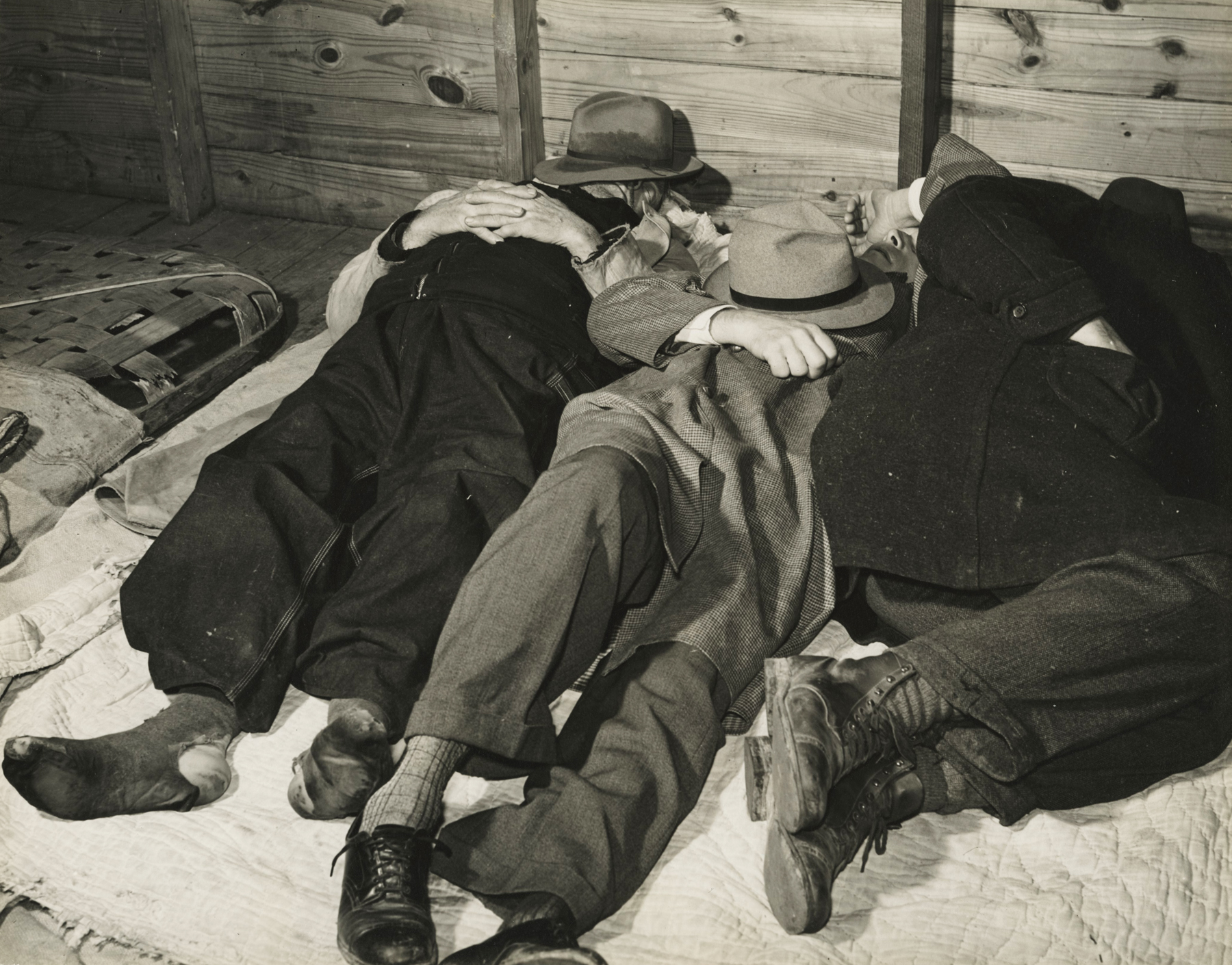 Marion Post-Wolcott - Tobacco Workers Taking a Nap in Tobacco Warehouse, Durham, NC, 1939 - Howard Greenberg Gallery
