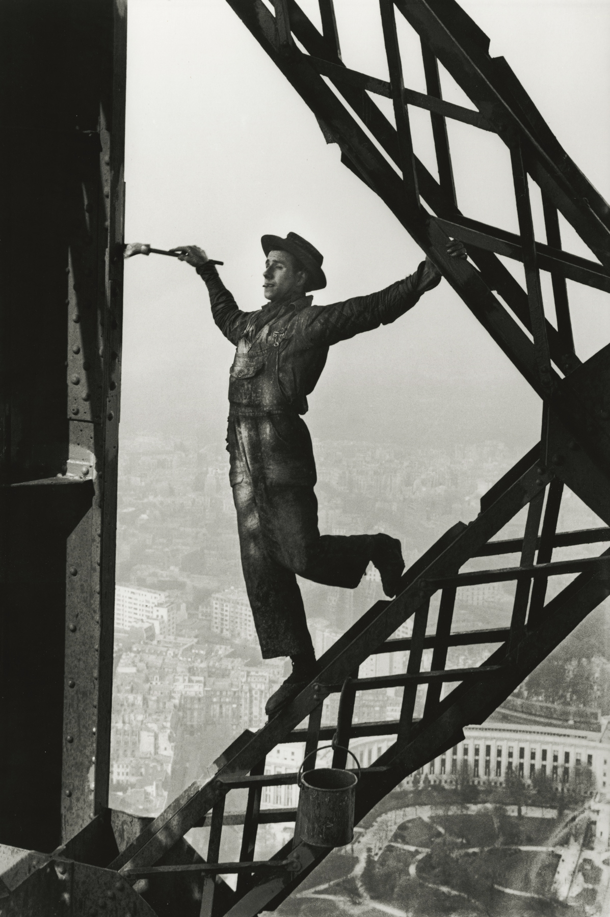 Marc Riboud - Painter on the Eiffel Tower, Paris, 1953 - Howard Greenberg Gallery