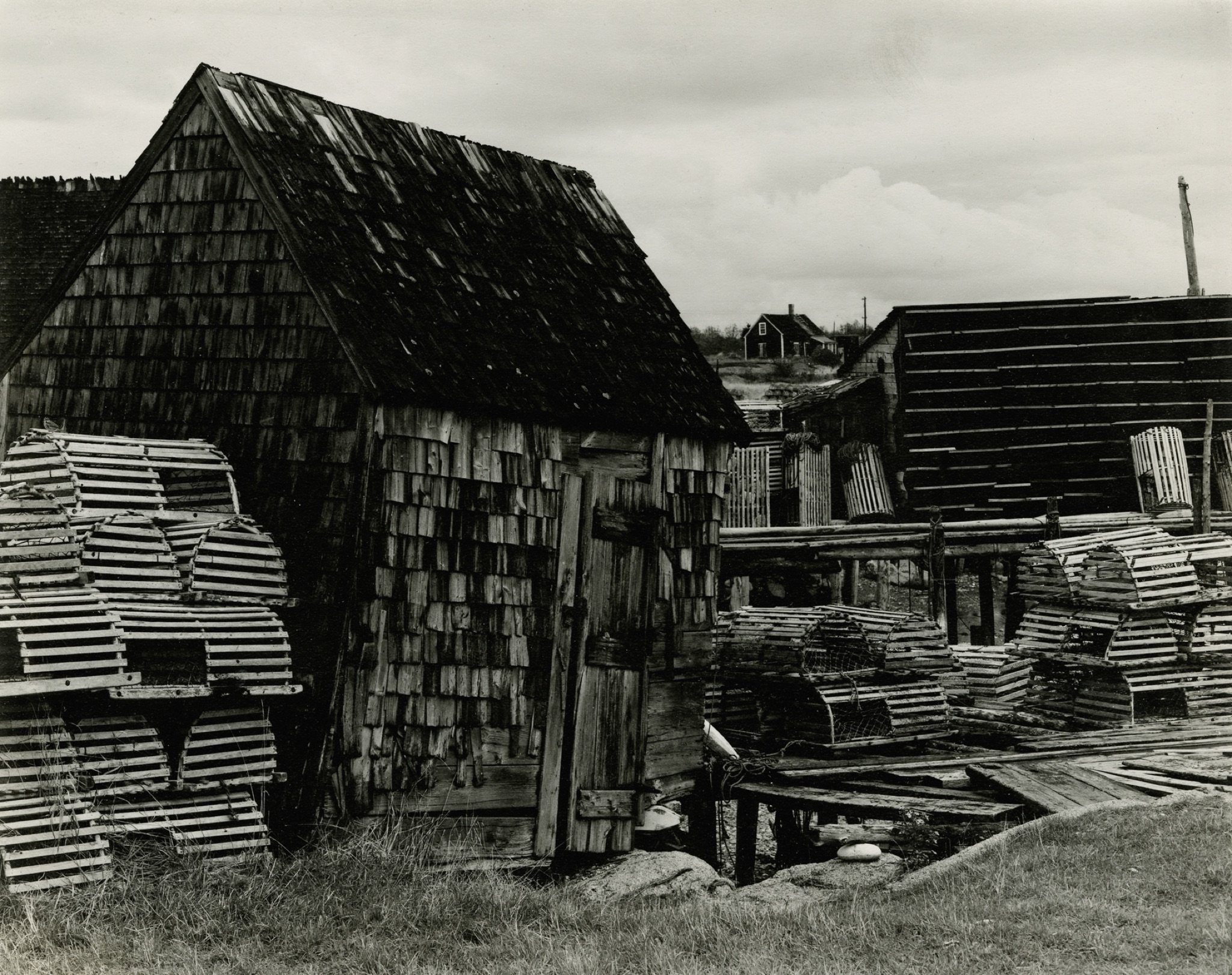 Fish Houses, Corea, Maine, 1945  Gelatin silver print; printed c.1945  7 3/4 x 9 1/2 inchesPeter MacLellan, South Uist, Hebrides, 1954  Gelatin silver print; printed c.1954  5 7/8 x 4 5/8 in.