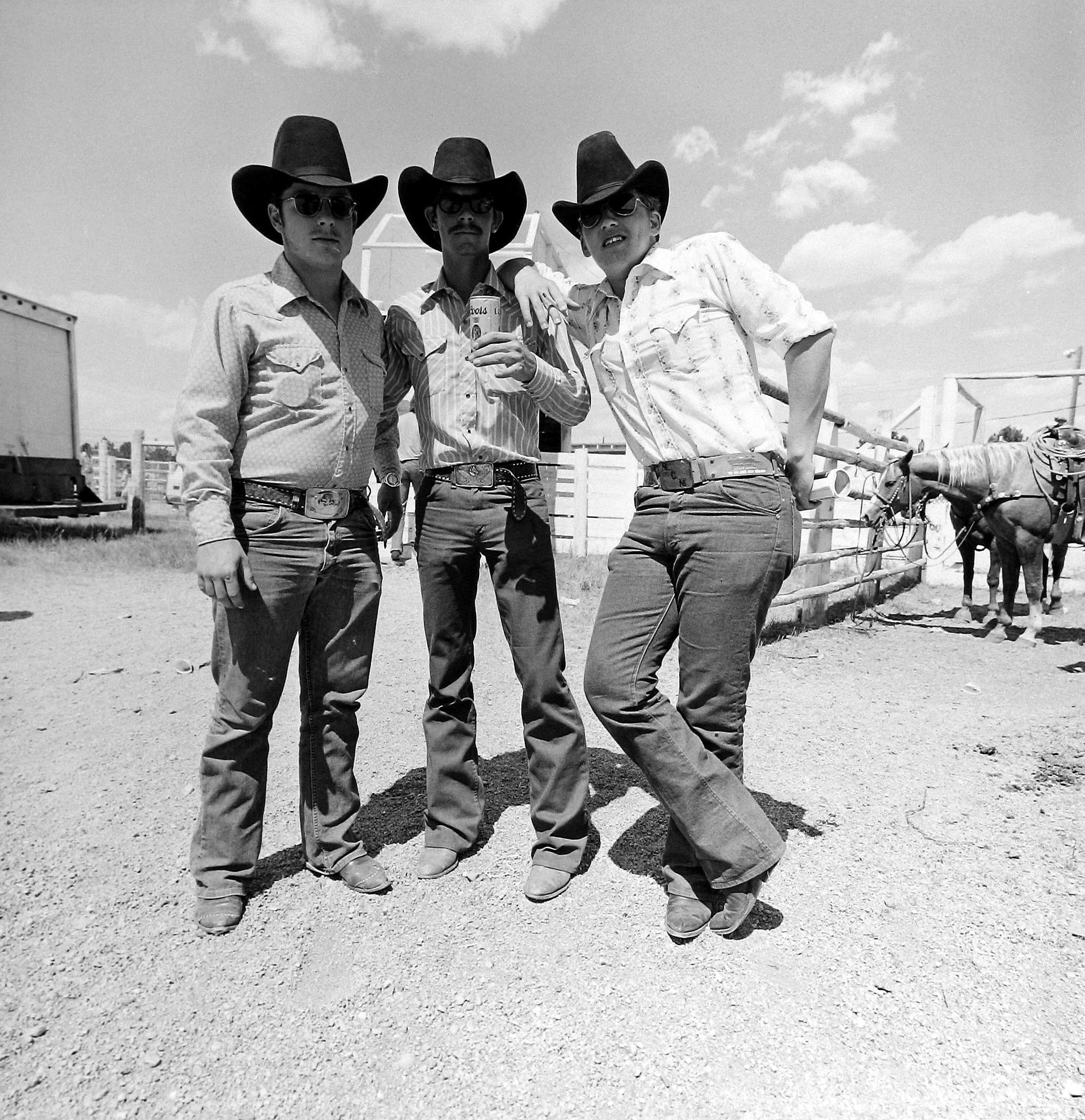 Tom Arndt - Three cowboys, Cheyenne, Wyoming, 1975 - Howard Greenberg Gallery
