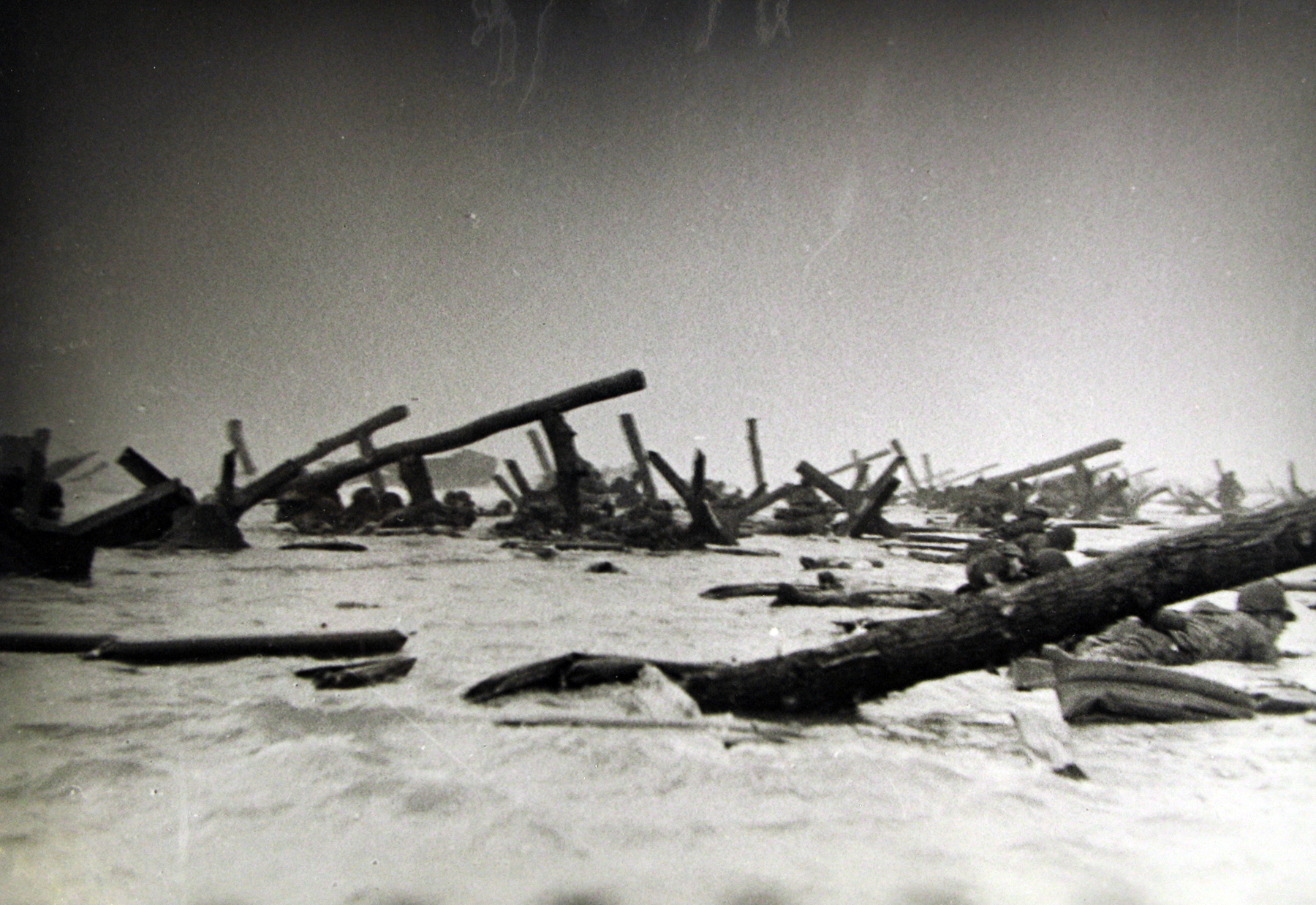 Robert Capa - American soldiers landing on Omaha Beach, D-Day, Normandy, France, 6-Jun-44 - Howard Greenberg Gallery