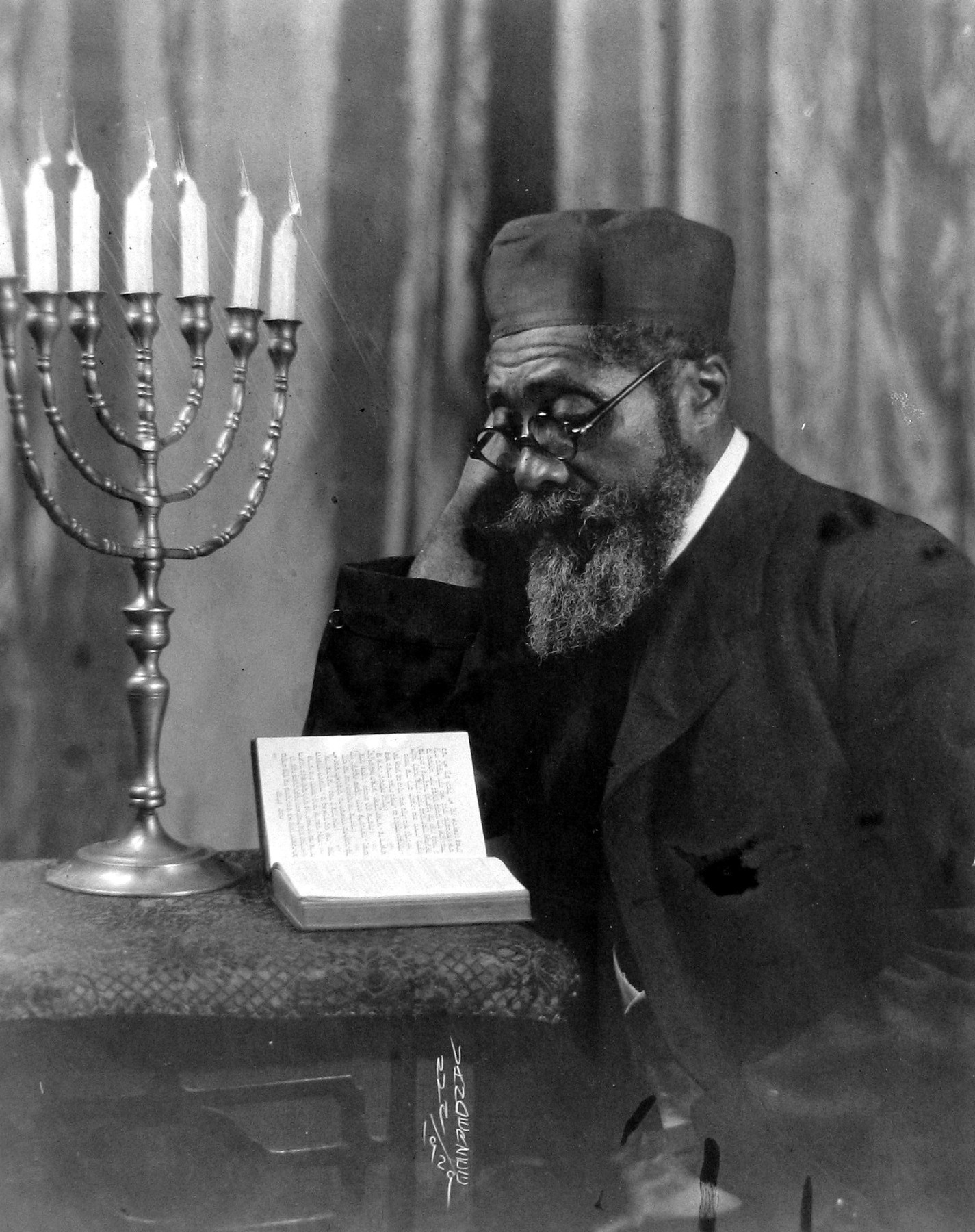 Untitled (man reading prayer book), 1929  Gelatin silver print; printed c.1929  9 1/2 x 7 1/2 inches