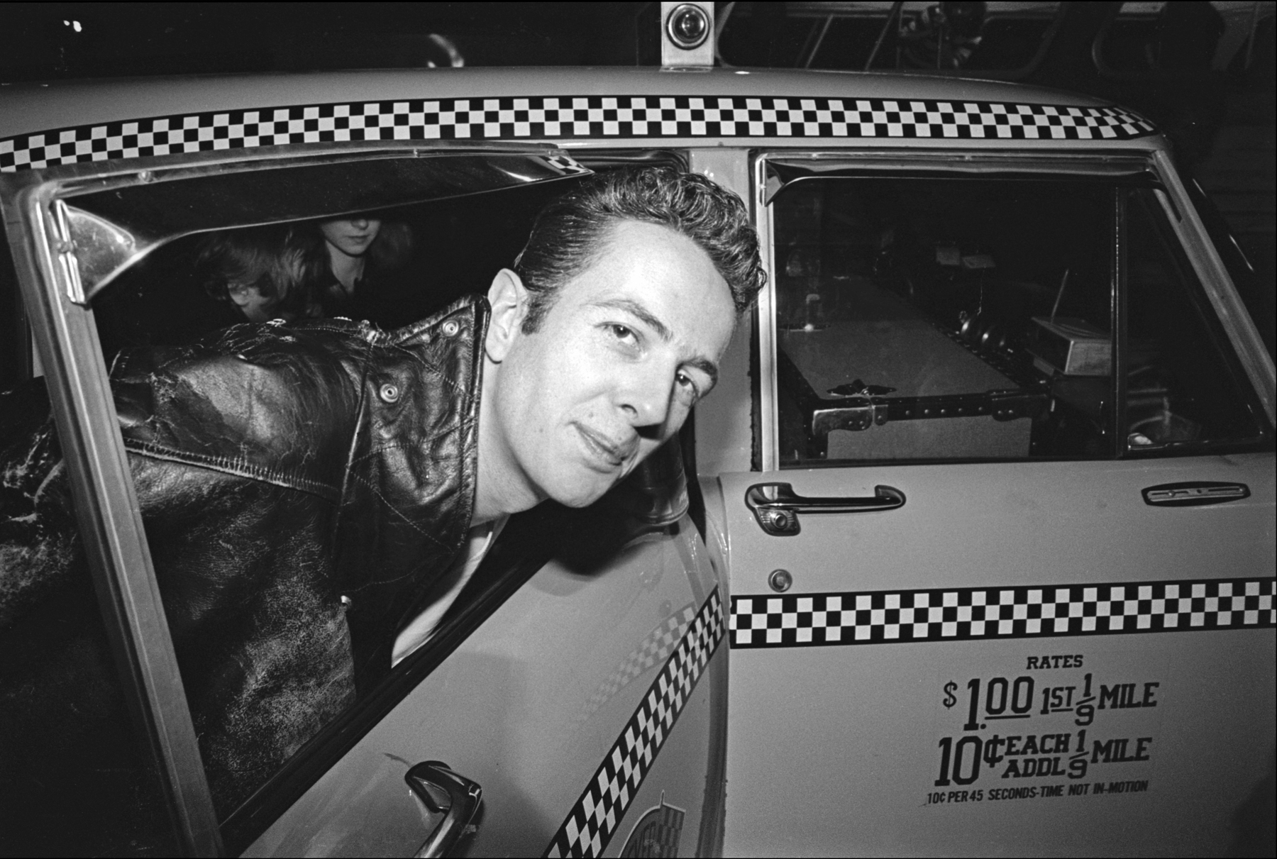 Joe Strummer of The Clash Enters a Taxi at JFK Airport, 1981
