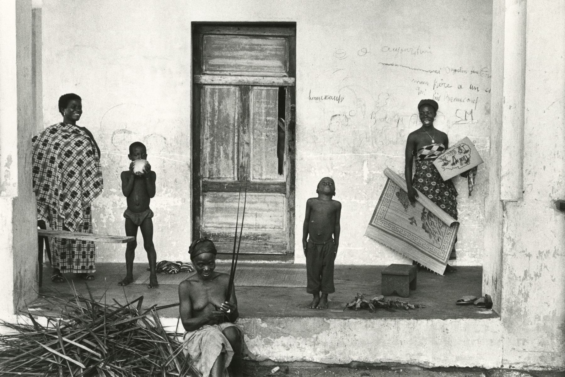 Untitled (Five figures on porch), 1963 Gelatin silver print; printed later c.1980 9 3/8 x 14 inches