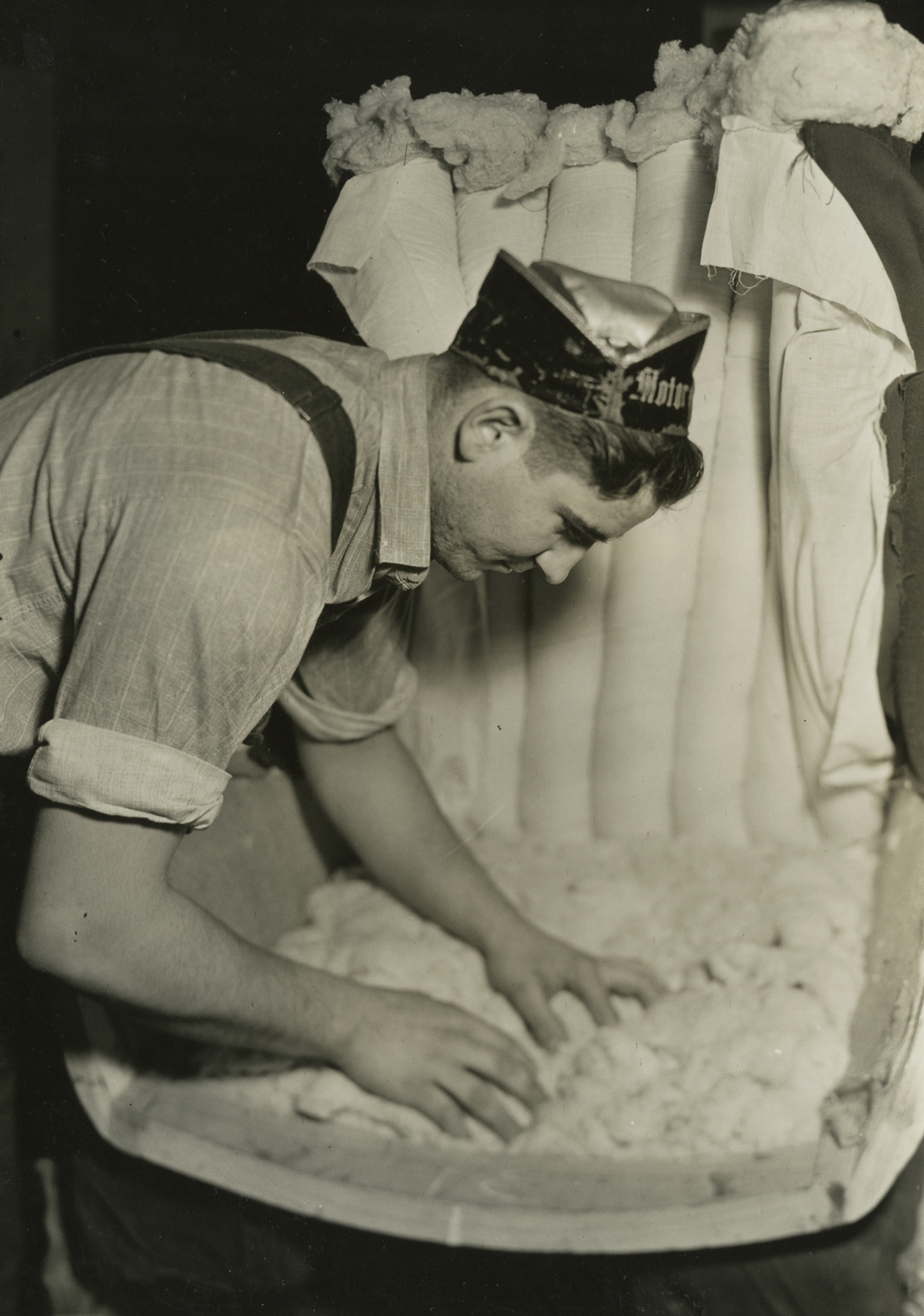 lewis hine, Applying filling to a channel back chair, Tomlinson Chair Manufacturing Co., High Point, North Carolina, 1937   Gelatin silver print; printed c.1937   6 5/8 x 4 5/8 inches